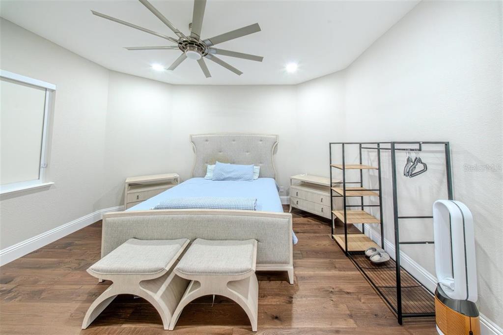 4303 Isabella Circle Windermere, FL 34786 - Photo 64 of 77 a view of a room with furniture and wooden floor