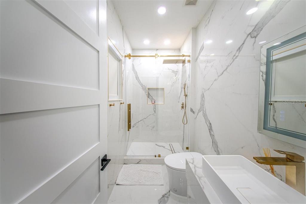 4303 Isabella Circle Windermere, FL 34786 - Photo 72 of 77 a bathroom with a sink a toilet and shower