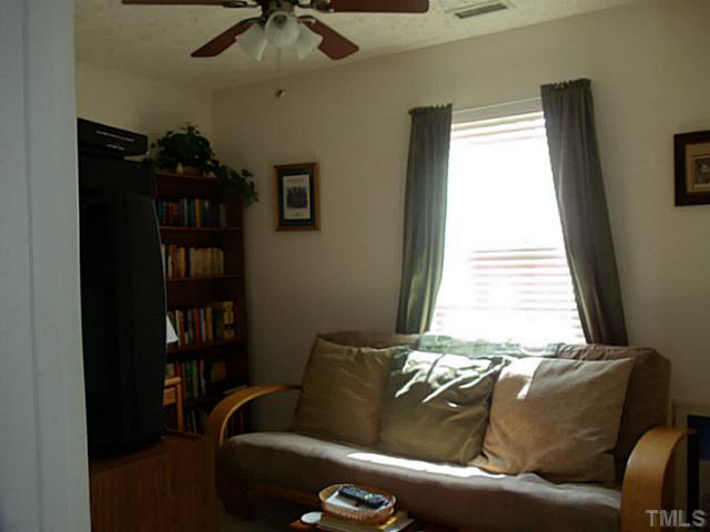 2315 Springhill Avenue Raleigh, NC 27603 - Photo 11 of 15 a living room with furniture and a window