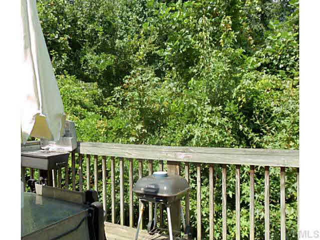 2315 Springhill Avenue Raleigh, NC 27603 - Photo 14 of 15 a view of a chair and table on the deck