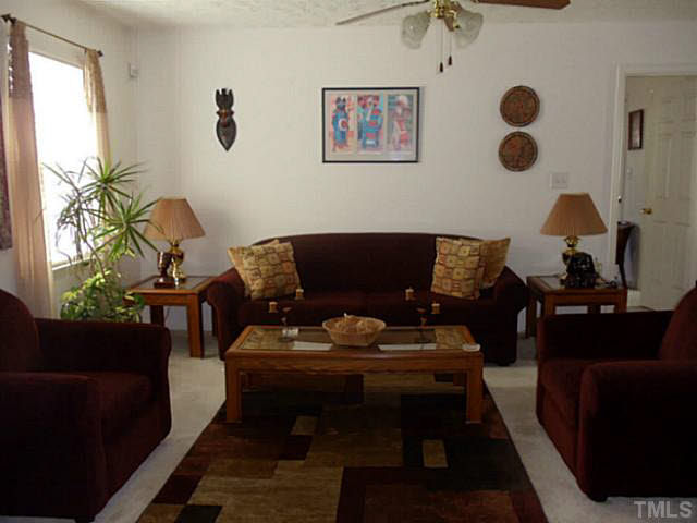 2315 Springhill Avenue Raleigh, NC 27603 - Photo 3 of 15 a living room with furniture and a window