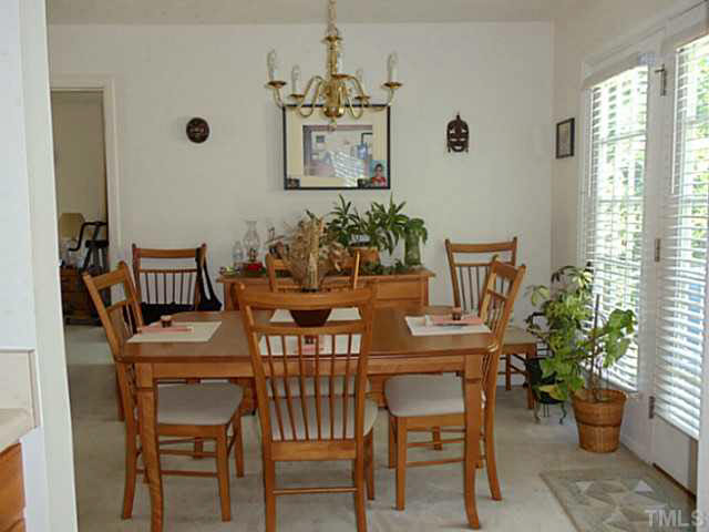 2315 Springhill Avenue Raleigh, NC 27603 - Photo 4 of 15 a view of a dining room with furniture and window