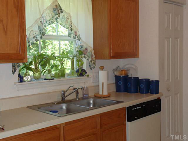 2315 Springhill Avenue Raleigh, NC 27603 - Photo 5 of 15 a kitchen with a sink and a window