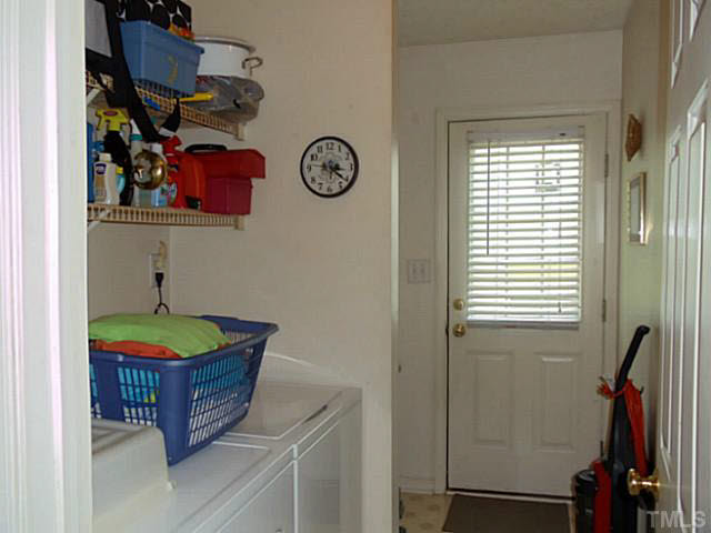 2315 Springhill Avenue Raleigh, NC 27603 - Photo 7 of 15 a bathroom with a mirror and a window