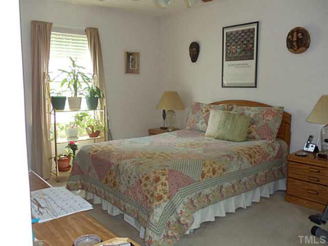 2315 Springhill Avenue Raleigh, NC 27603 - Photo 8 of 15 a bedroom with a bed and window