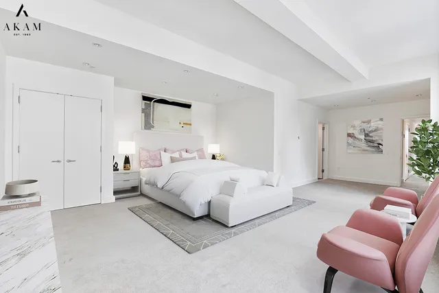 a bedroom with a bed and a couch