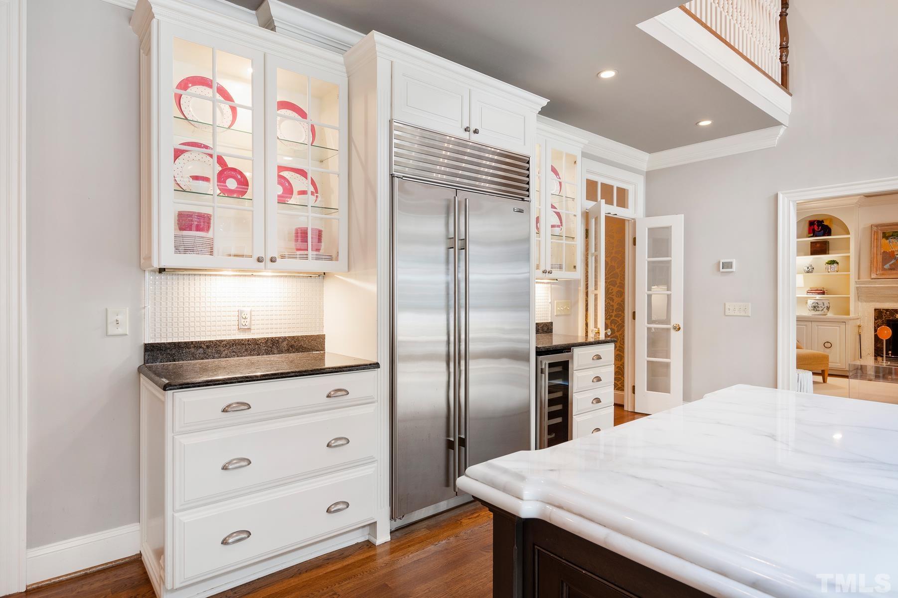 1430 Chester Road Raleigh, NC 27608 - Photo 13 of 39 a kitchen with granite countertop a refrigerator and a sink