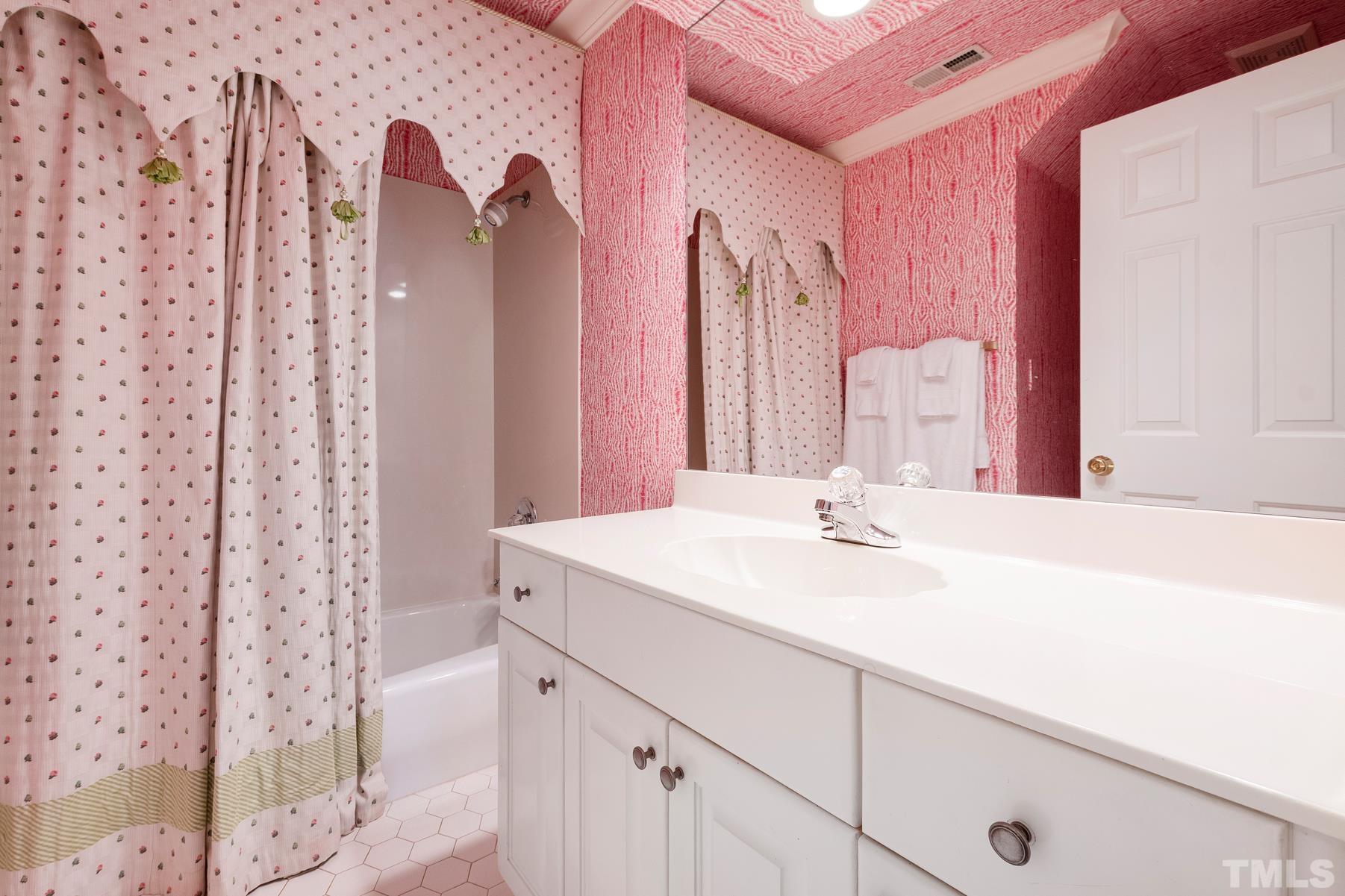 1430 Chester Road Raleigh, NC 27608 - Photo 25 of 39 a bathroom with a sink and a mirror