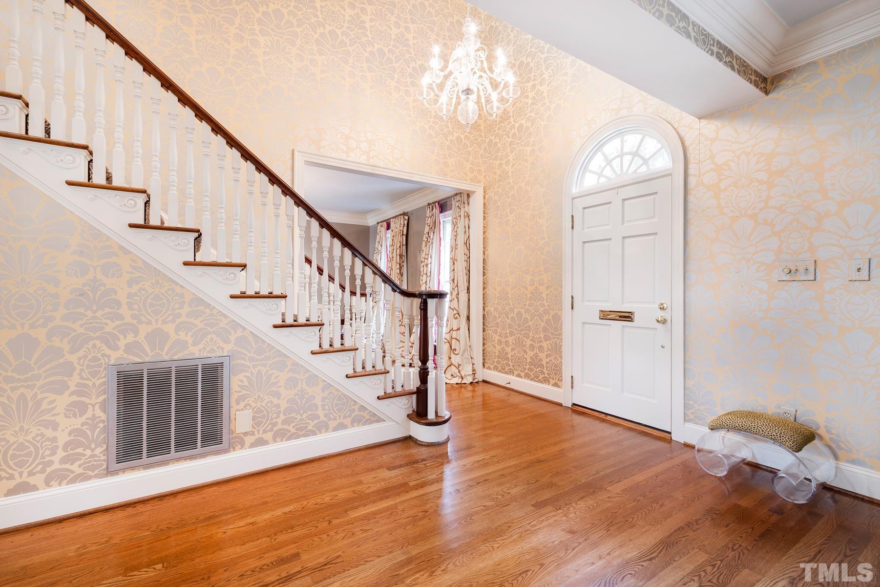 1430 Chester Road Raleigh, NC 27608 - Photo 3 of 39 a view of entryway and hall with wooden floor