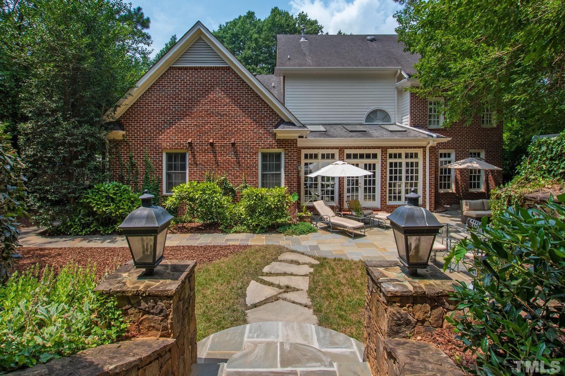 1430 Chester Road Raleigh, NC 27608 - Photo 31 of 39 a view of a house with sitting area and garden