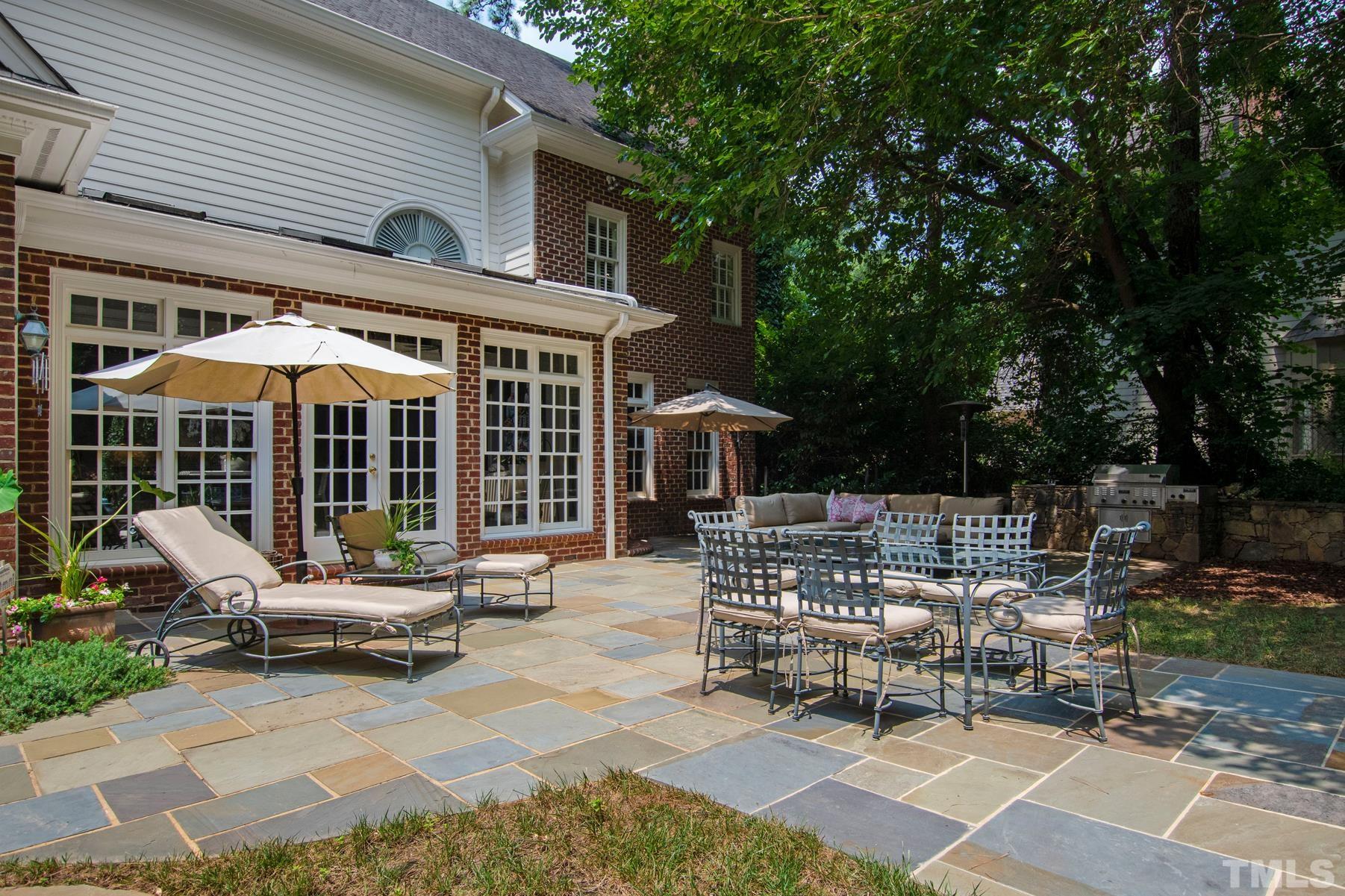 1430 Chester Road Raleigh, NC 27608 - Photo 32 of 39 a view of a patio with table and chairs and potted plants