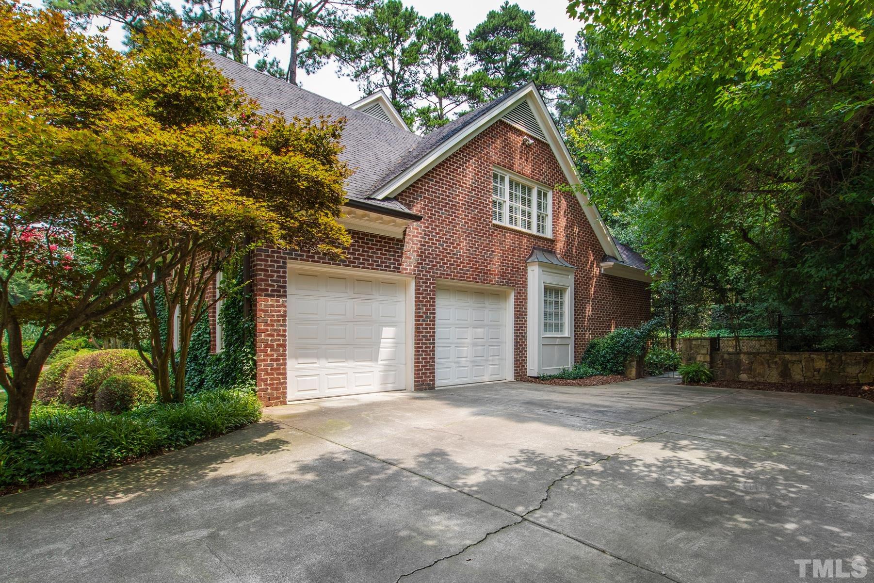 1430 Chester Road Raleigh, NC 27608 - Photo 38 of 39 a front view of a house with a yard and garage