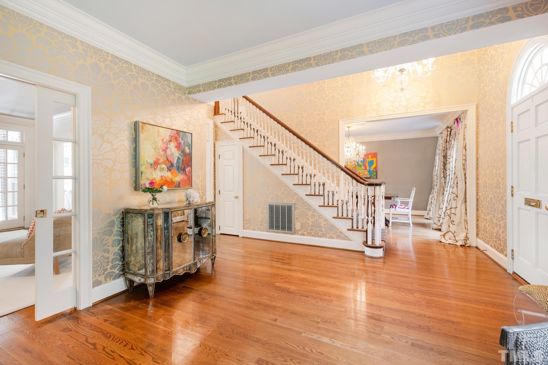 1430 Chester Road Raleigh, NC 27608 - Photo 4 of 39 a view of an entryway with wooden floor