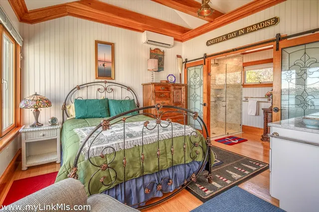 a bedroom with bed and window