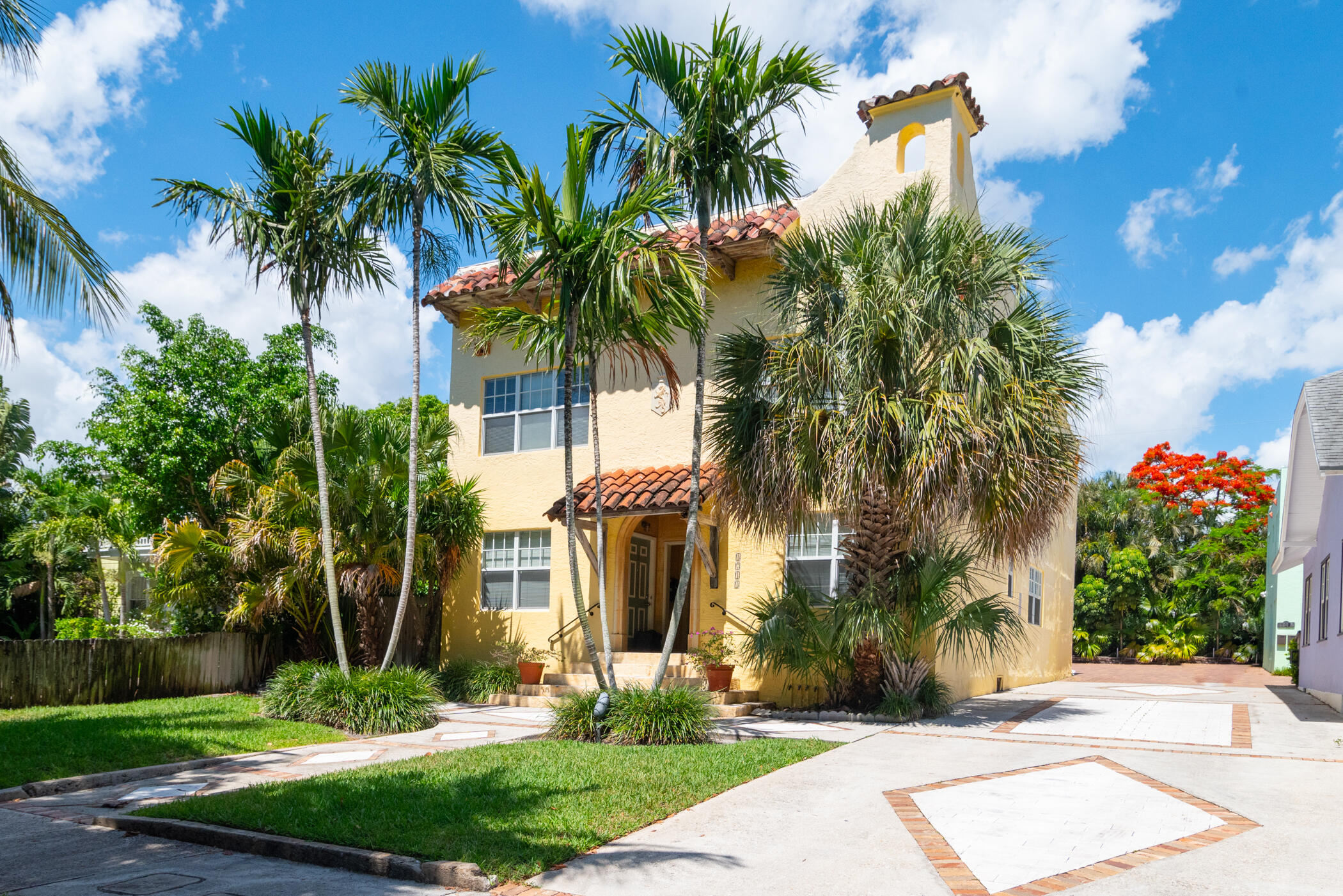 1711 Florida Avenue, Unit 4 West Palm Beach, FL 33401 - Photo 4 of 4 a front view of multi story residential apartment building with yard and green space