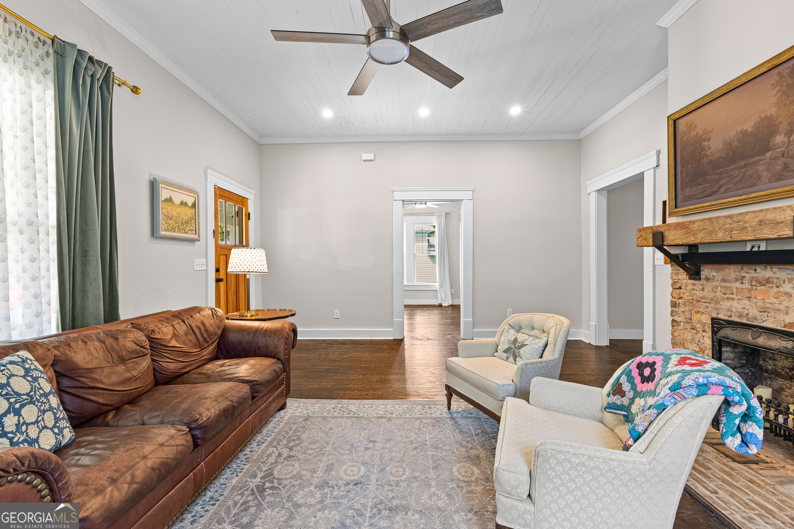 96 Griffin Street Grantville, GA 30220 - Photo 12 of 63 a living room with fireplace furniture and a flat screen tv