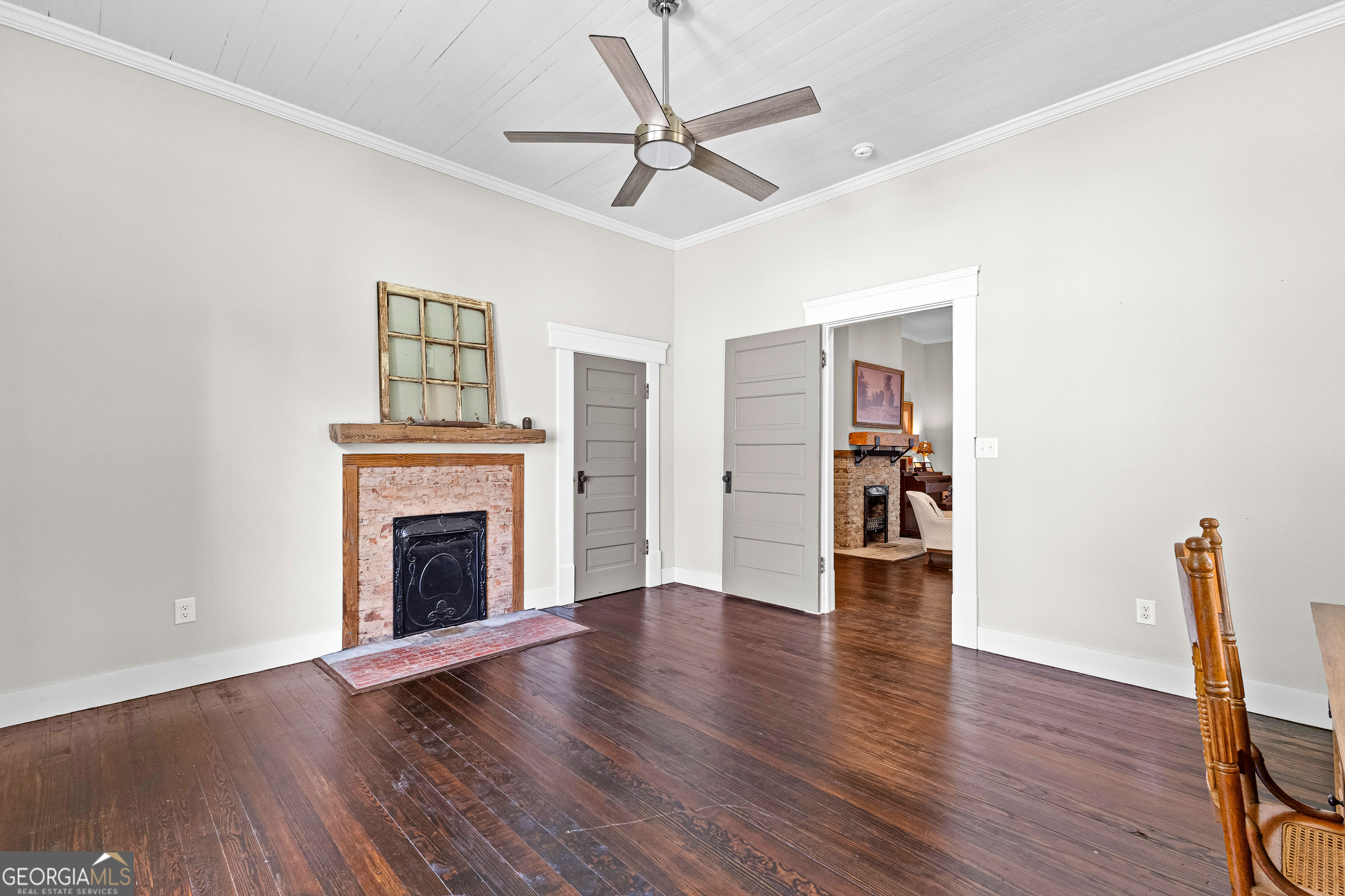 96 Griffin Street Grantville, GA 30220 - Photo 16 of 63 a view of empty room with wooden floor and fan
