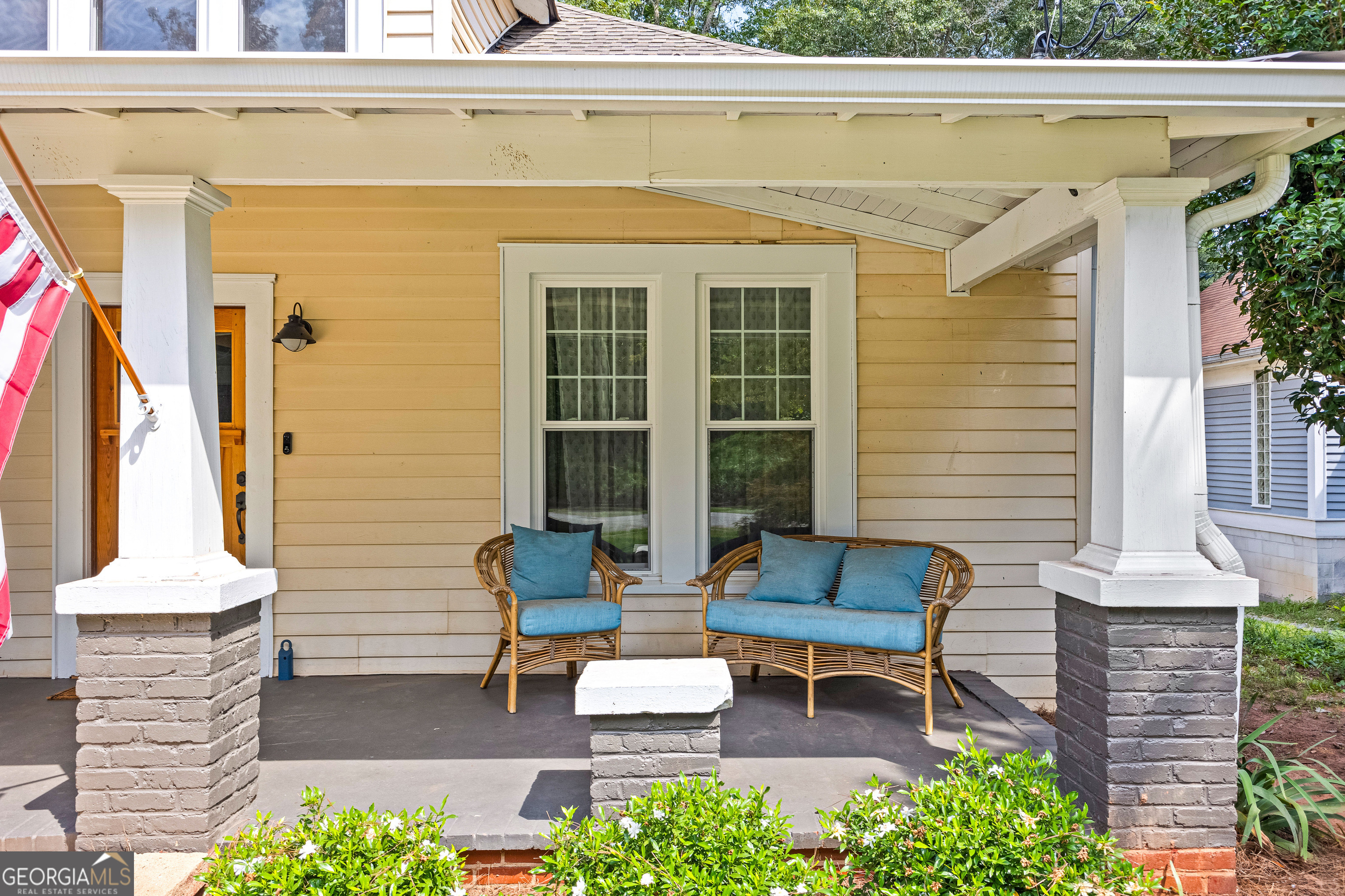 96 Griffin Street Grantville, GA 30220 - Photo 4 of 63 a wooden bench sitting in front of a house