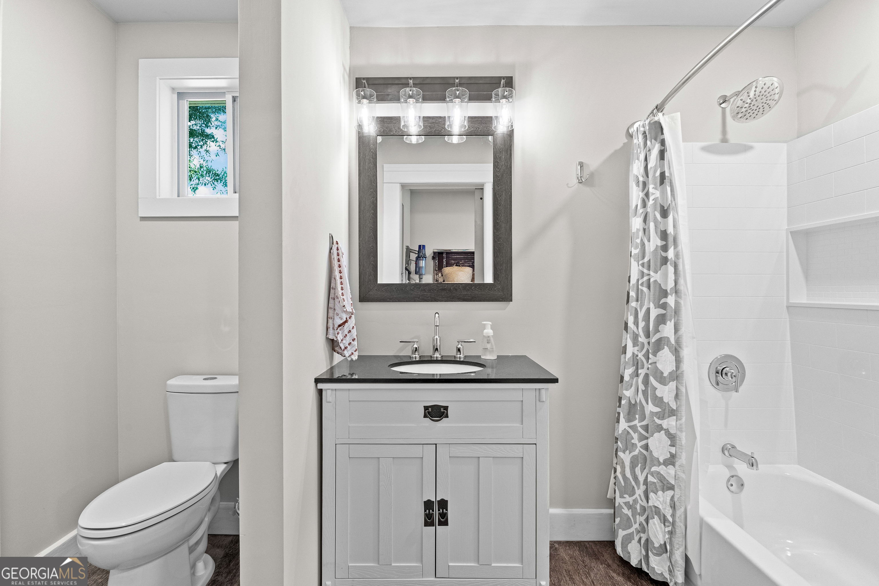 96 Griffin Street Grantville, GA 30220 - Photo 43 of 63 a bathroom with a sink a toilet and shower