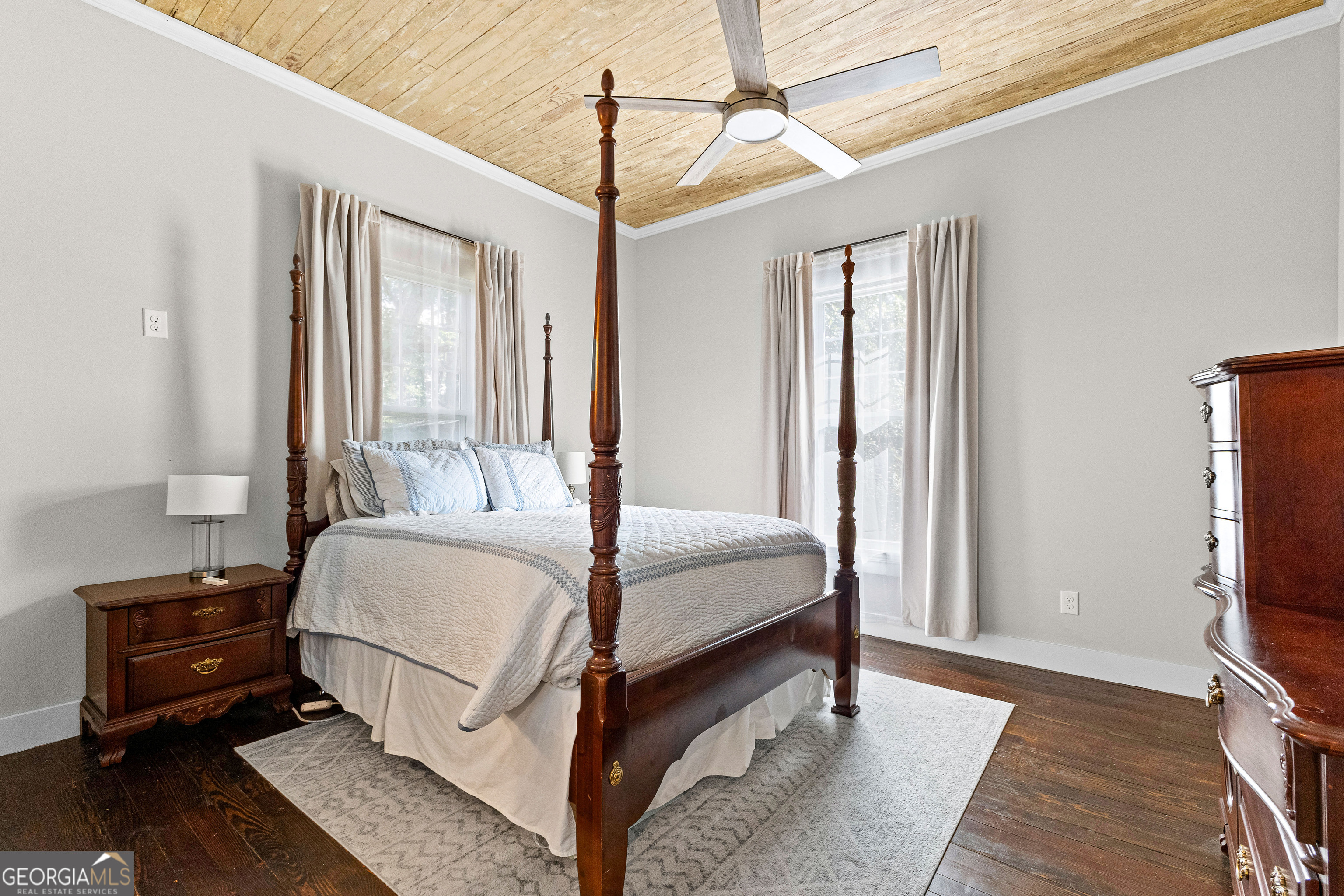 96 Griffin Street Grantville, GA 30220 - Photo 45 of 63 a bedroom with a bed a flat screen tv and a window