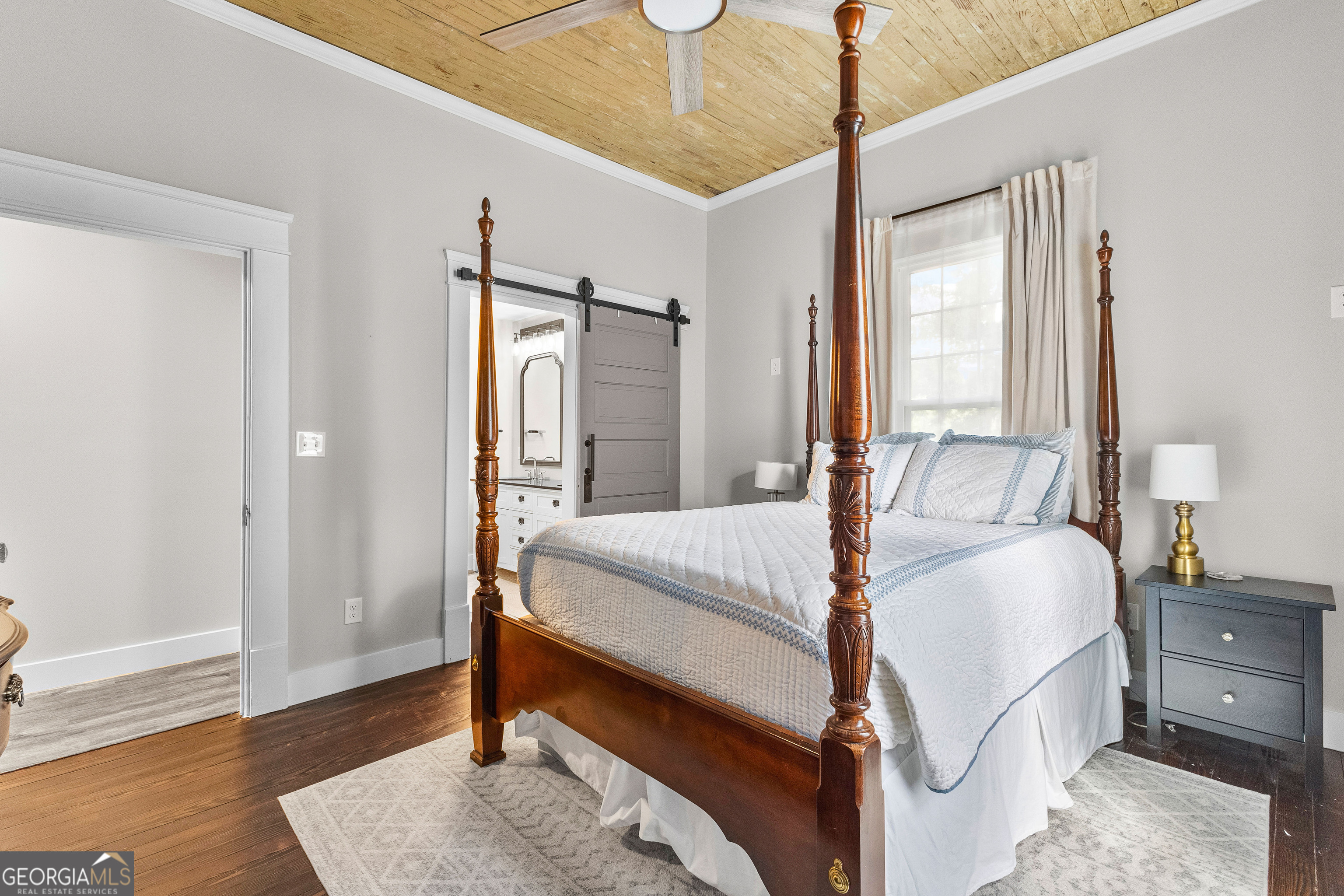 96 Griffin Street Grantville, GA 30220 - Photo 46 of 63 a bedroom with a bed and wooden floor