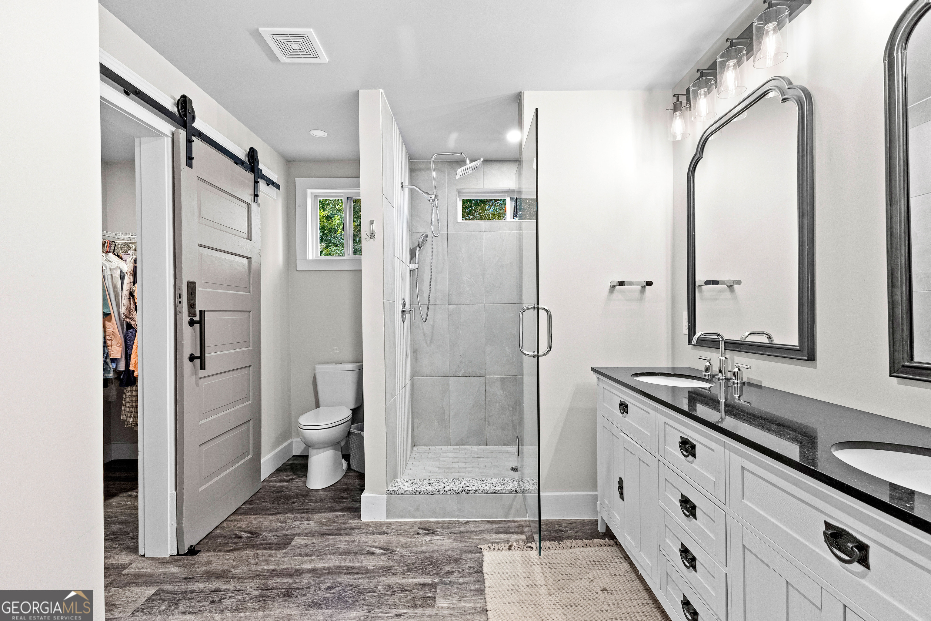 96 Griffin Street Grantville, GA 30220 - Photo 47 of 63 a bathroom with a glass shower door and a sink