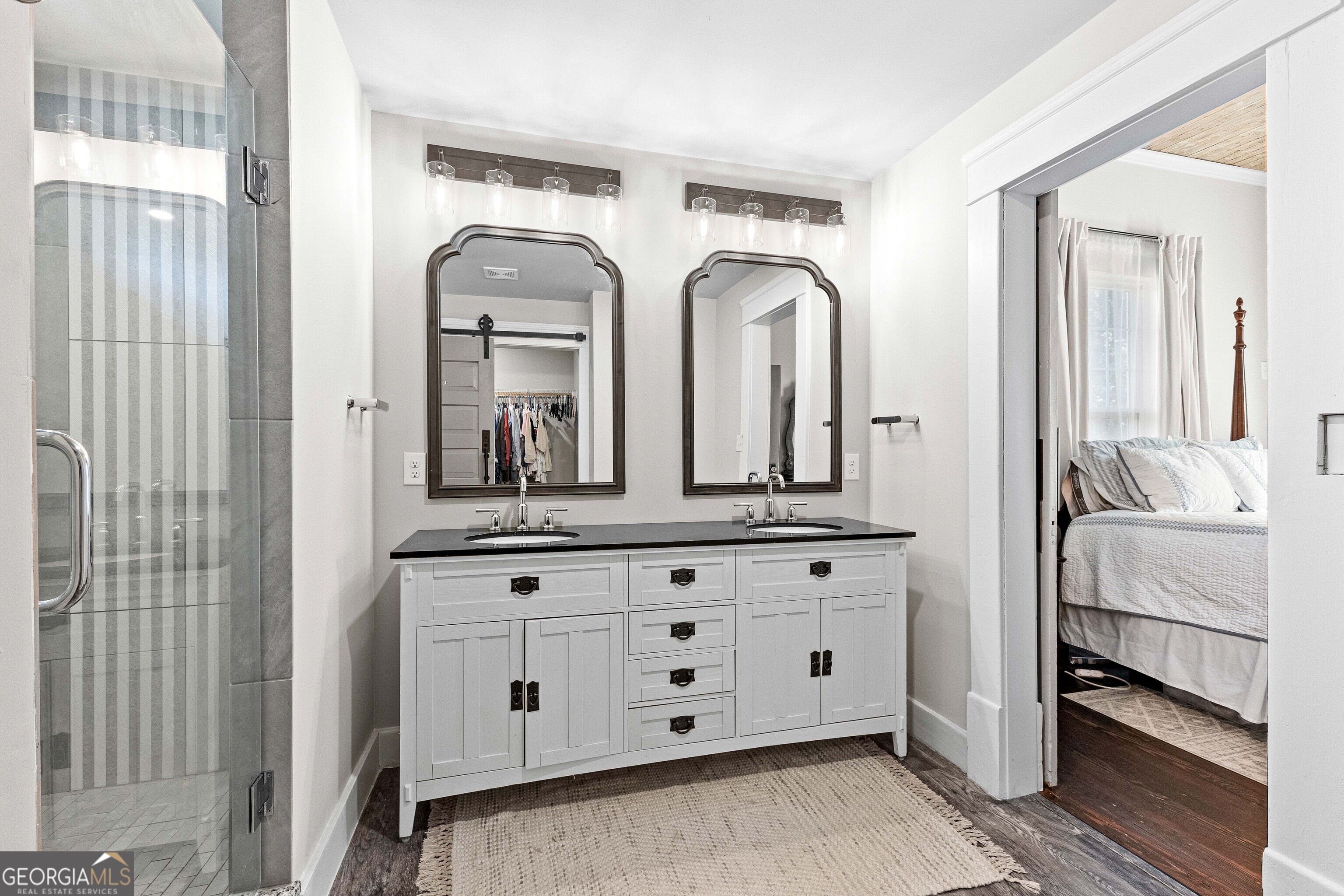 96 Griffin Street Grantville, GA 30220 - Photo 48 of 63 a en suite bathroom with double vanity and a mirror