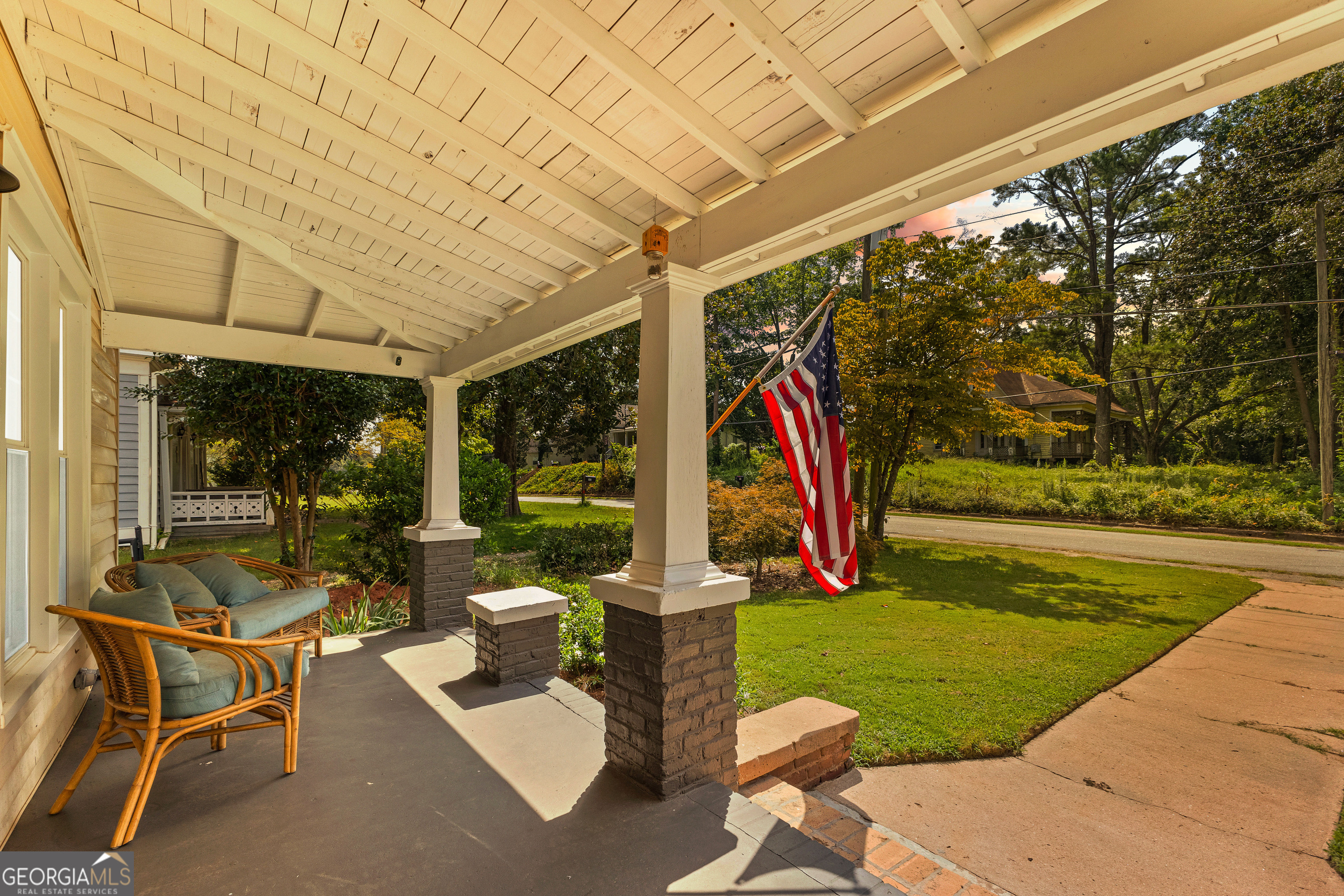 96 Griffin Street Grantville, GA 30220 - Photo 5 of 63 a view of a patio with table and chairs potted plants and floor to ceiling window