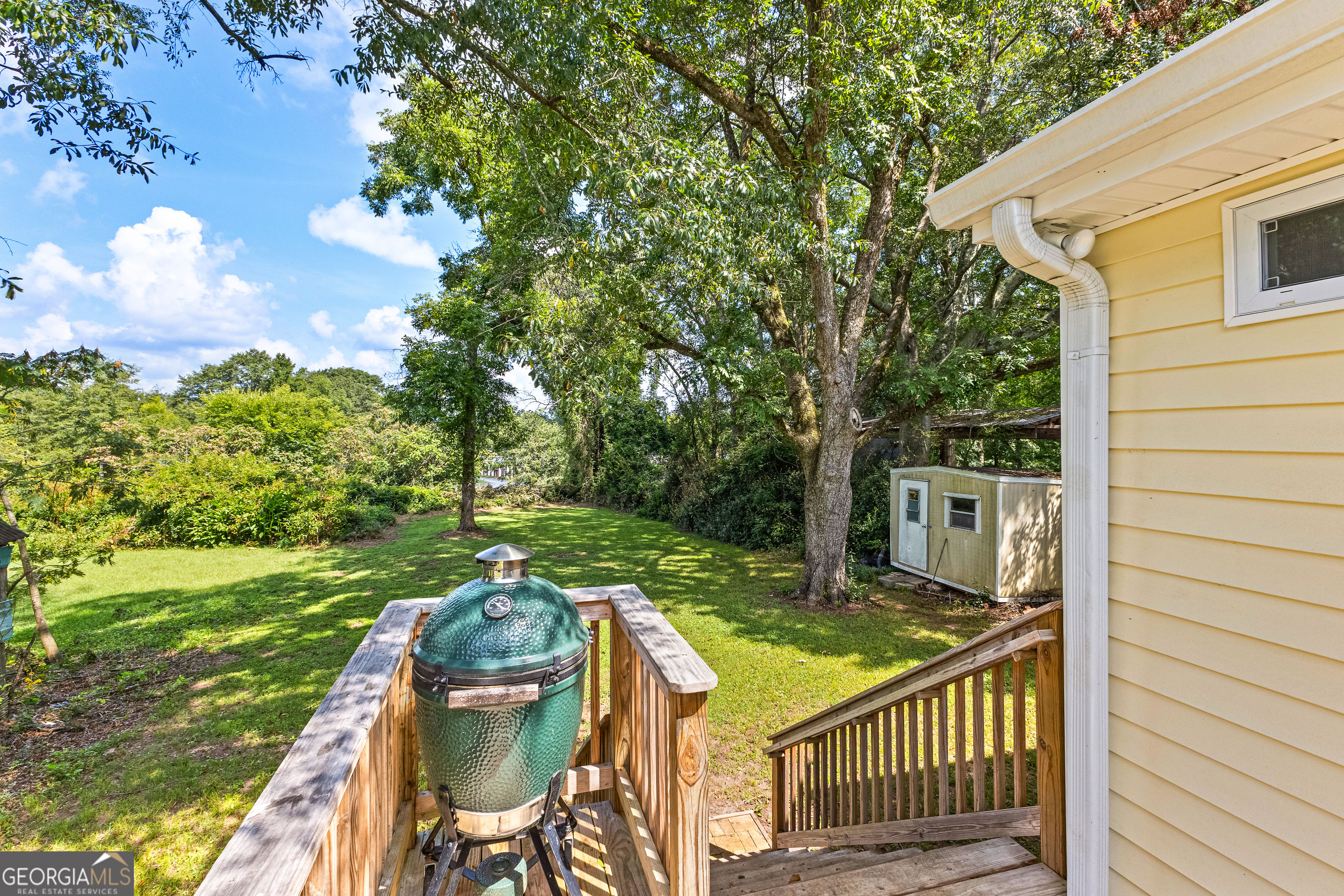 96 Griffin Street Grantville, GA 30220 - Photo 56 of 63 a view of a chair and table in backyard of the house