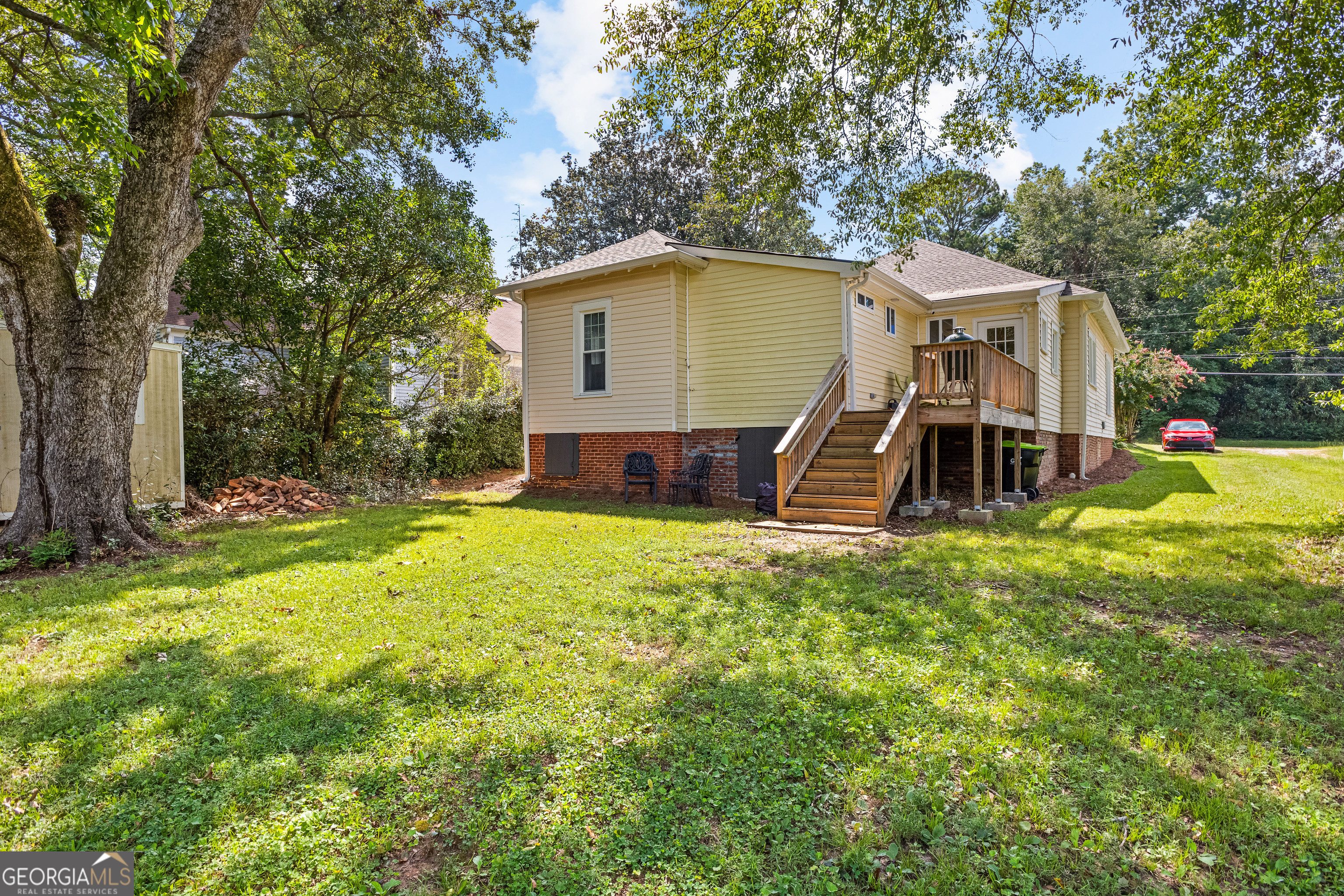 96 Griffin Street Grantville, GA 30220 - Photo 59 of 63 a view of a house with a backyard