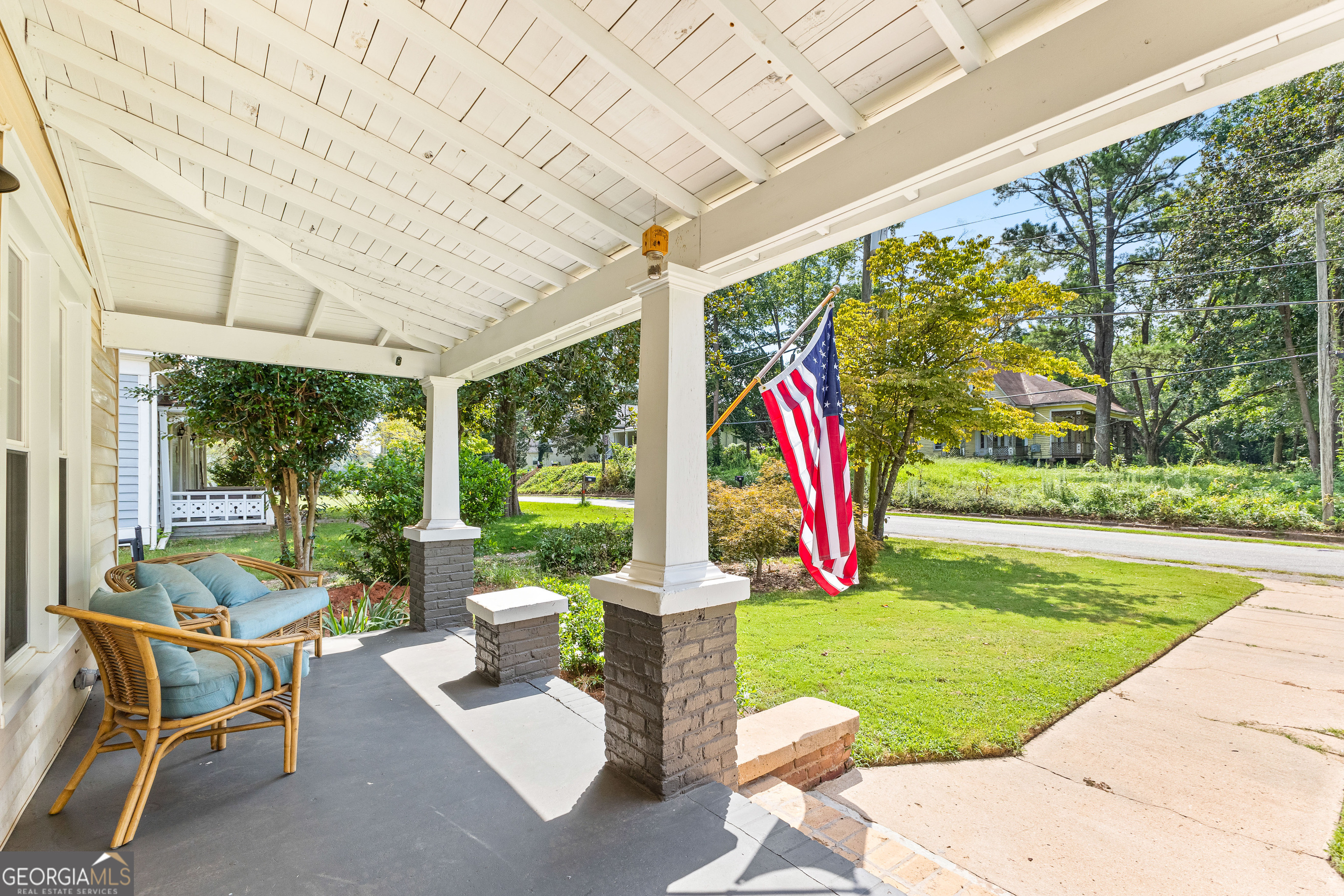 96 Griffin Street Grantville, GA 30220 - Photo 6 of 63 a view of a patio with a table chairs and a yard
