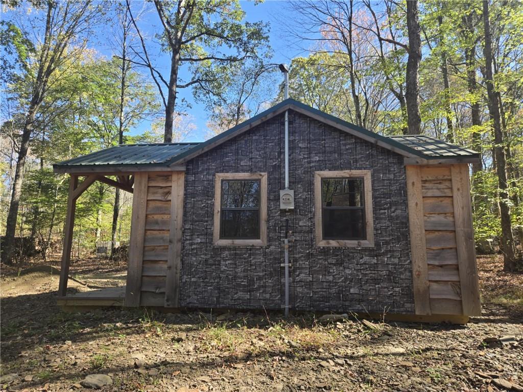 20 Buck Drive Benezett, PA 15821 - Photo 5 of 7 a brick house with a large tree