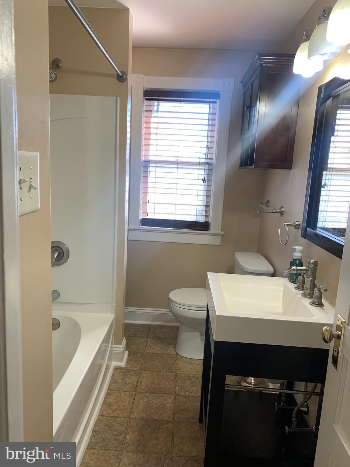 119 Grandview Avenue Pitman, NJ 08071 - Photo 14 of 28 a bathroom with a sink a toilet and bathtub