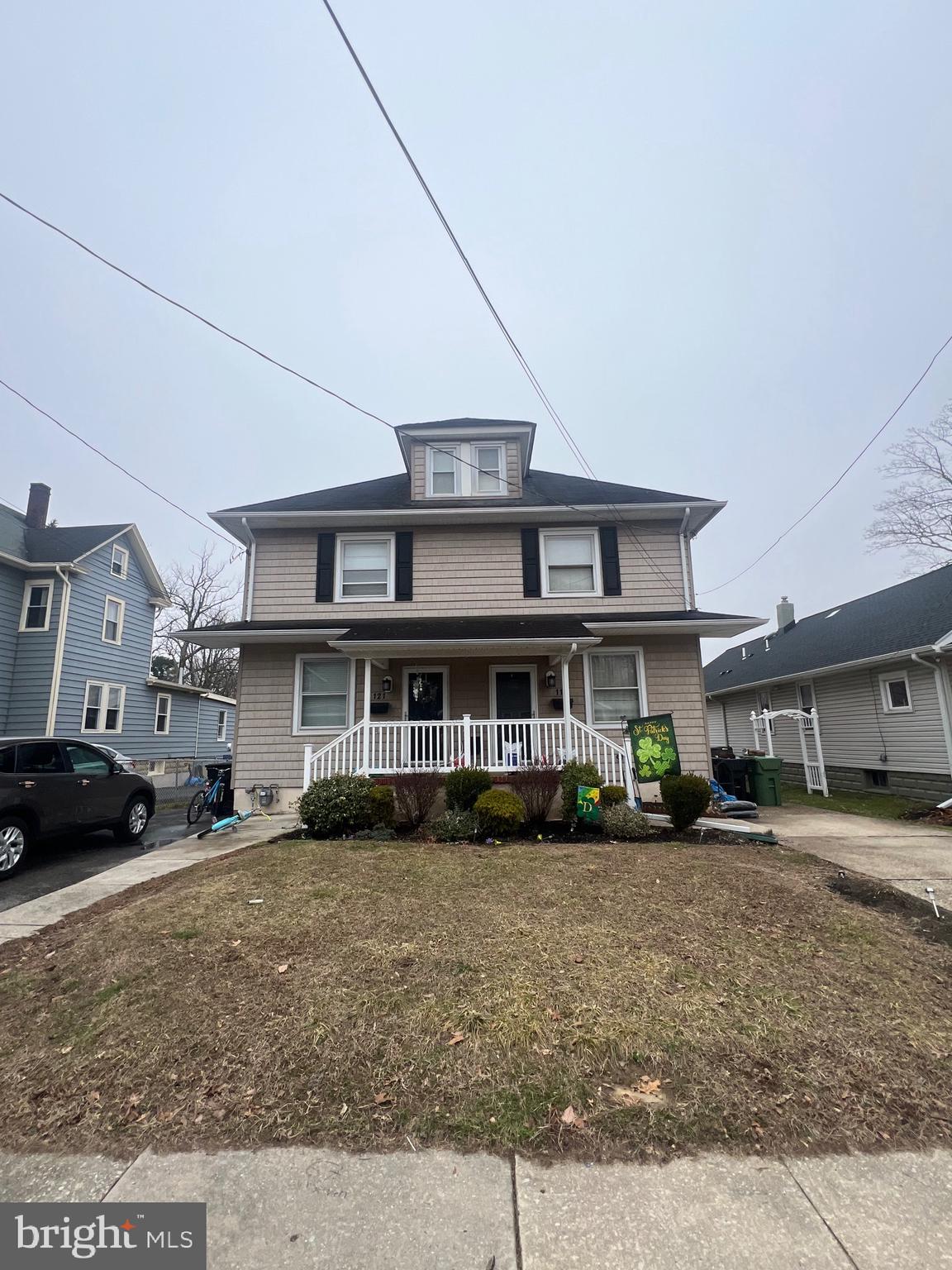 119 Grandview Avenue Pitman, NJ 08071 - Photo 5 of 28 a front view of a residential apartment building with a yard