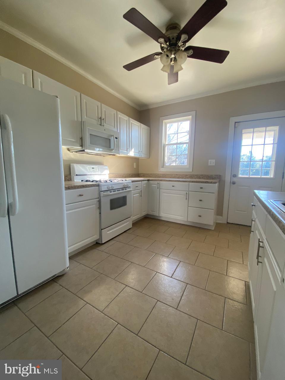119 Grandview Avenue Pitman, NJ 08071 - Photo 8 of 28 a kitchen with a cabinets and window