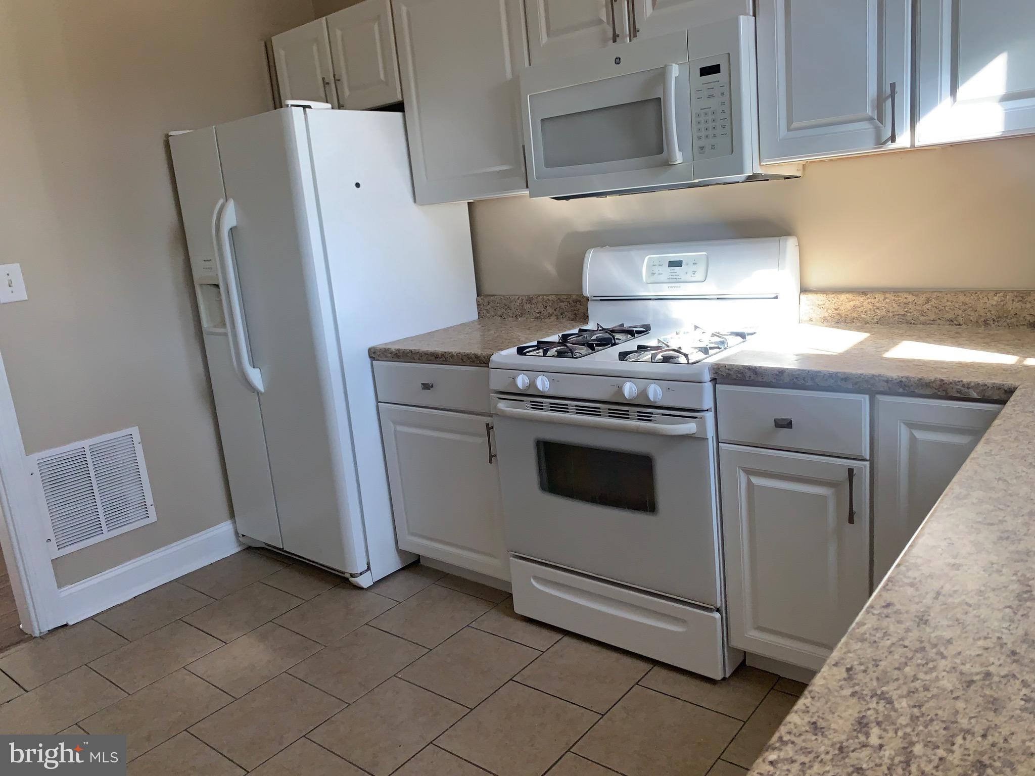 119 Grandview Avenue Pitman, NJ 08071 - Photo 9 of 28 a kitchen with white cabinets and white appliances