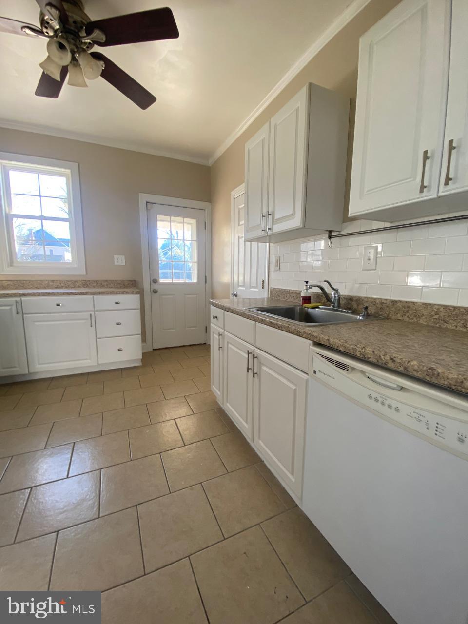 119 Grandview Avenue Pitman, NJ 08071 - Photo 10 of 28 a kitchen with a sink a stove cabinets and counter space