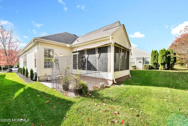 a front view of a house with a yard and porch