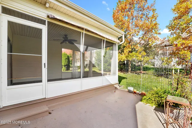 a front view of a house with a yard balcony
