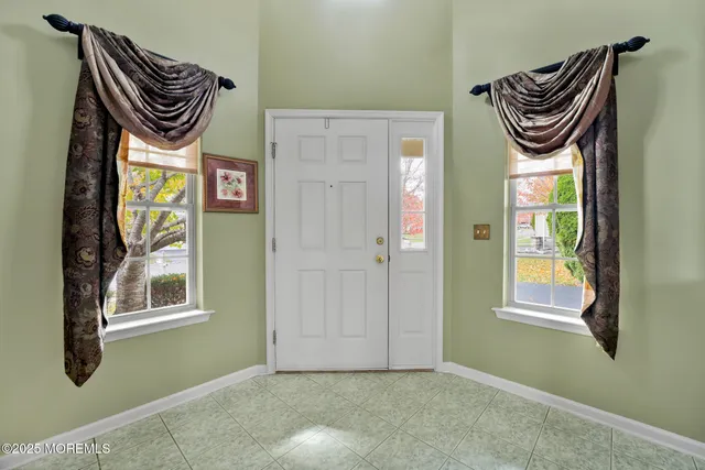 a front view of a door and bedroom