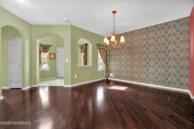 a view of livingroom with window and wooden floor
