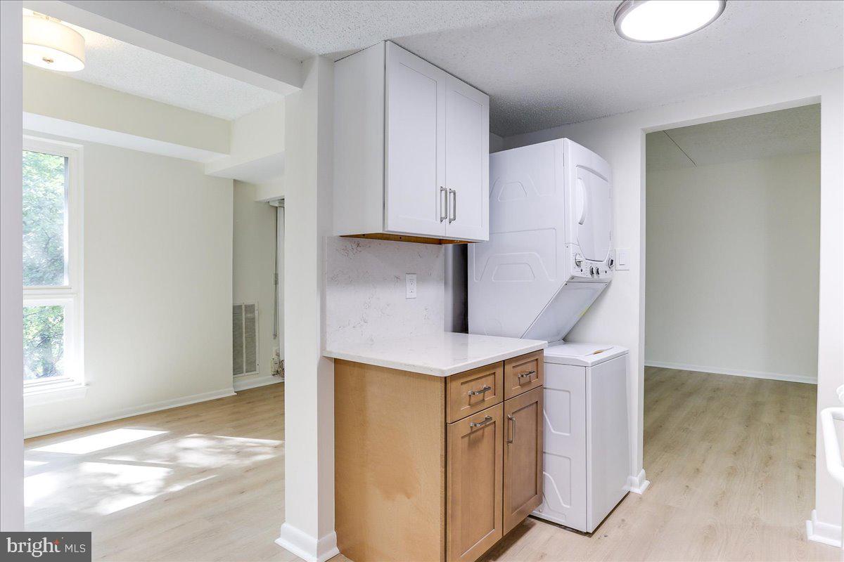 11823 Breton Court, Unit 2B Reston, VA 20191 - Photo 13 of 21 a kitchen with a stove and a refrigerator