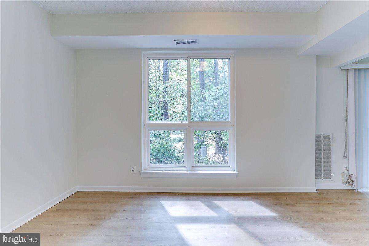 11823 Breton Court, Unit 2B Reston, VA 20191 - Photo 14 of 21 an empty room with windows