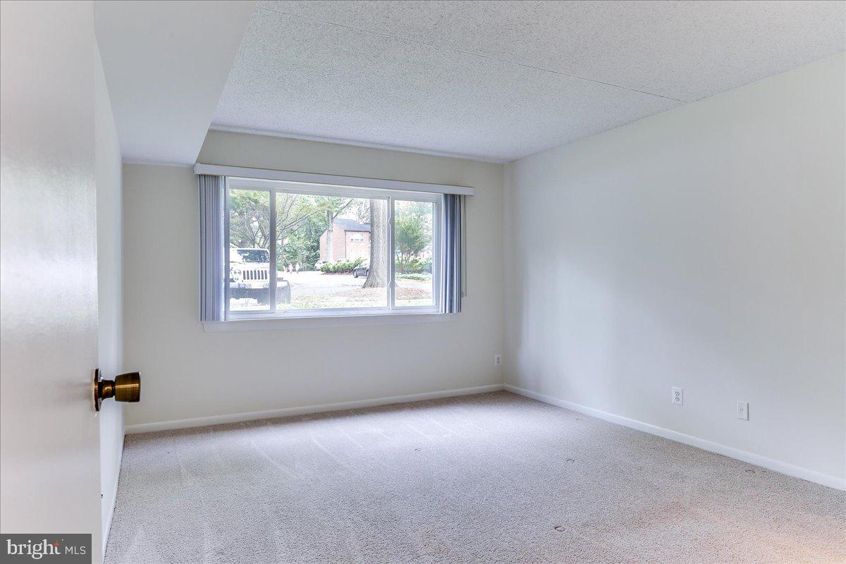 11823 Breton Court, Unit 2B Reston, VA 20191 - Photo 17 of 21 an empty room with a window