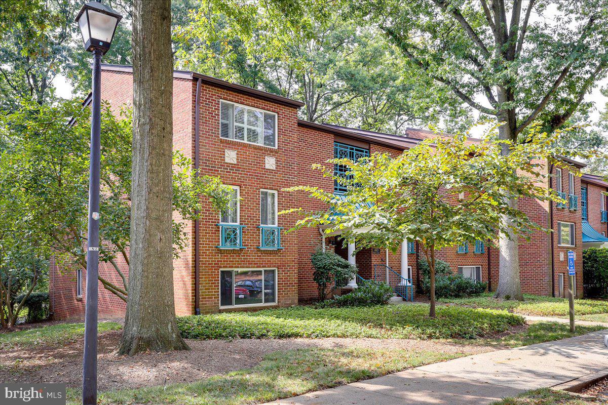 11823 Breton Court, Unit 2B Reston, VA 20191 - Photo 2 of 21 a front view of a house with garden