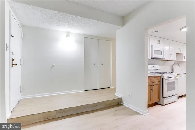 a spacious bathroom with a sink and a mirror