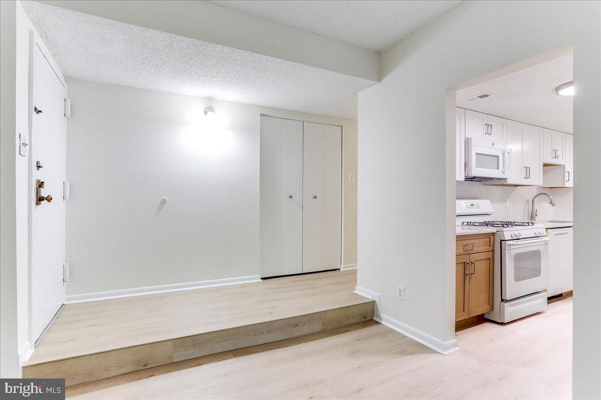11823 Breton Court, Unit 2B Reston, VA 20191 - Photo 7 of 21 a spacious bathroom with a sink and a mirror