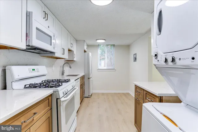 a kitchen with a stove and a sink
