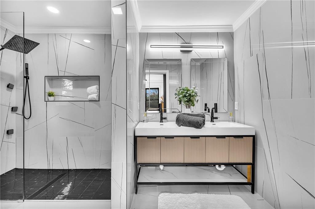 1306 Poplarcrest Circle Southeast Atlanta, GA 30316 - Photo 13 of 24 a bathroom with a sink and a mirror