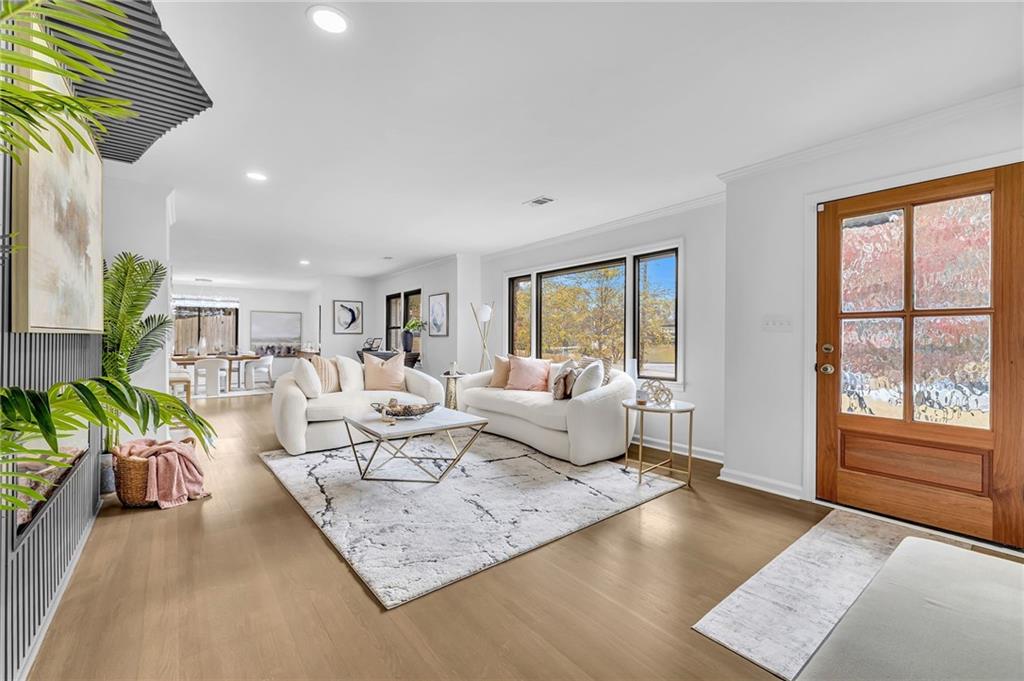 1306 Poplarcrest Circle Southeast Atlanta, GA 30316 - Photo 4 of 24 a living room with furniture floor to ceiling window and wooden floor